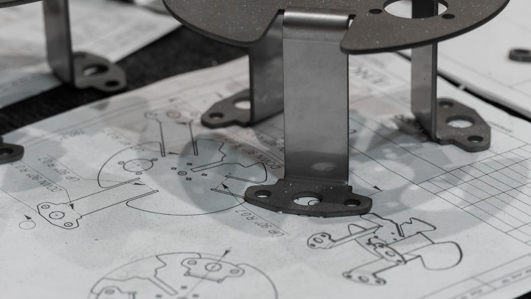 Every detail matters. A manufactured component is verified against its original schematics, ensuring perfect adherence to the design intent. https://www.encata.net/services/mechanical-engineering-services?utm_source=unsplashu0026utm_medium=organicu0026utm_content=image